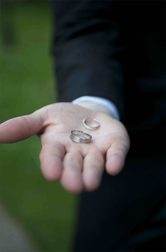 Best man displaying the rings at the wedding of Gill and Alan by Cambridge photographer Richard Bowring