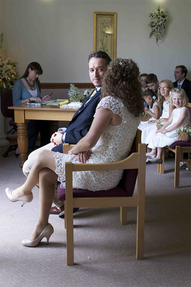 A quiet moment in the registry office from the wedding of Mike and vic in Ely by Cambridge based photographer Richard Bowring