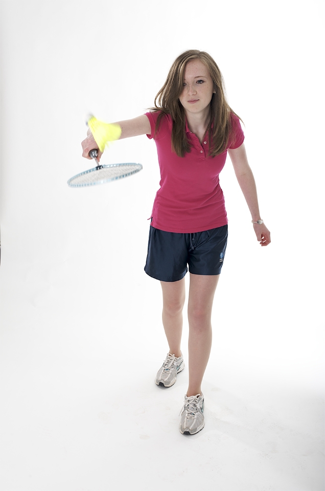A photograph of a female student of Comberton Village College playing badminton by cambridge photographer Richard Bowring